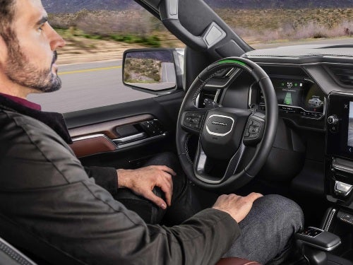 2025 GMC Sierra 1500 view of man in driver seat with hands off of wheel